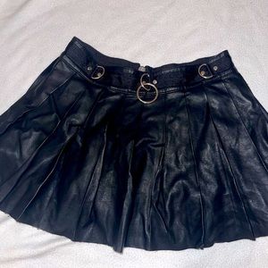 black (fake) leather ruffled mini skirt with metal cuffs
